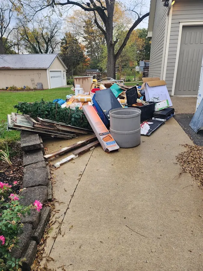 Dumpster being loaded with debris for Commercial Dumpster Rental in Toccoa
